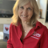 A woman with blonde hair and a red shirt.