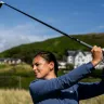 Beth Roberts with golf club.