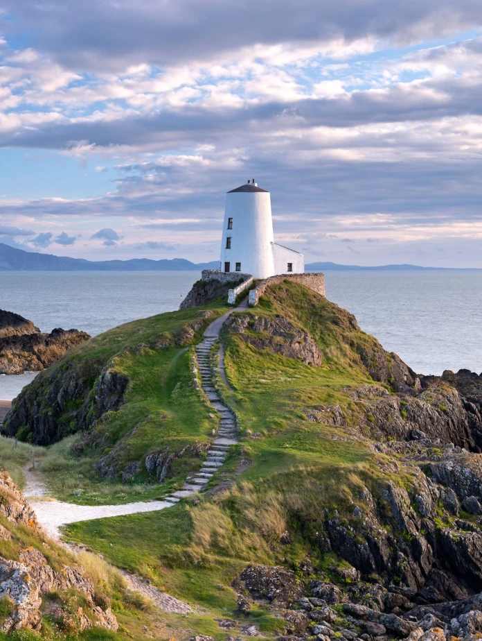 A lighthouse on an island by the coast
