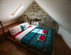 Bed in one of the rooms at Fforest.
