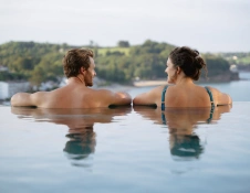 couple in infinity pool.