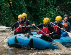 group of people on raft.