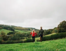 couple walking in countryside.