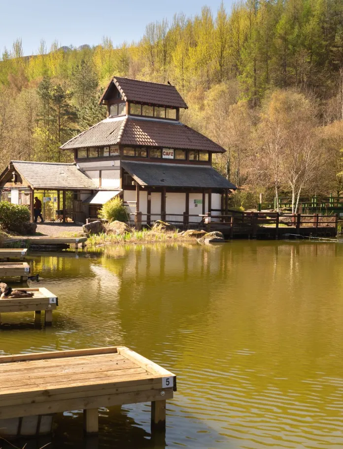 A lake with a building next to it.