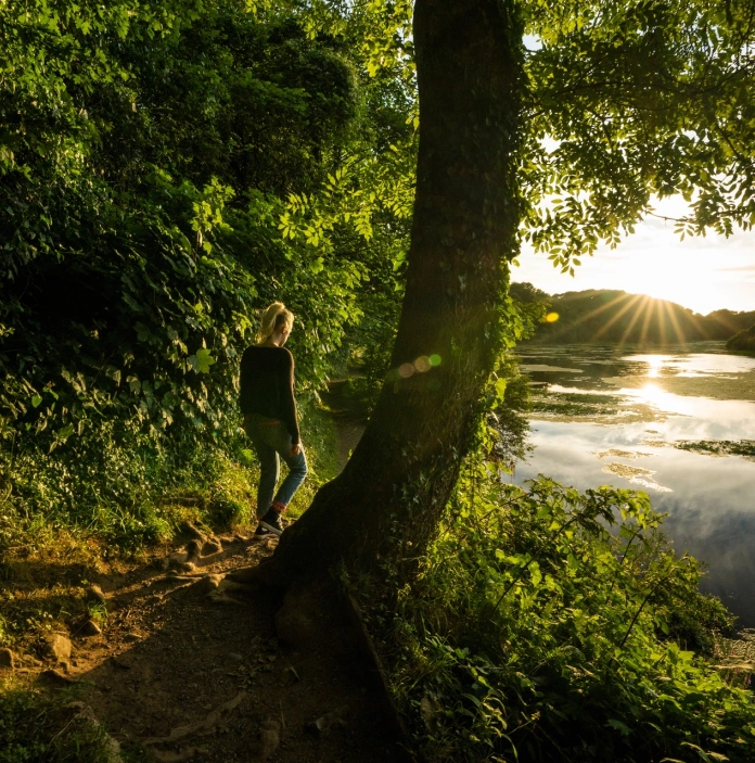 A woman walking at Bosherton lily ponds.