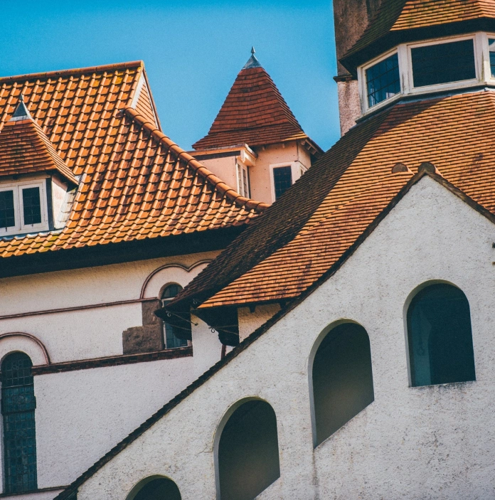 exterior of Caldey Abbey, windows and roofs.