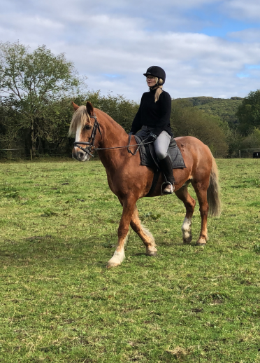 Esyllt Sears and Sarah Breese on horseback in a field