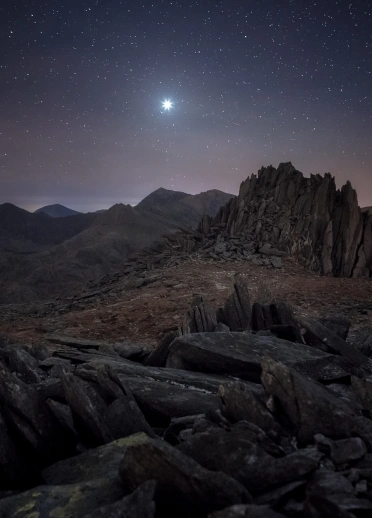 Dark skies on mountainside.