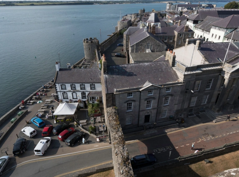 Town walls next to the sea.