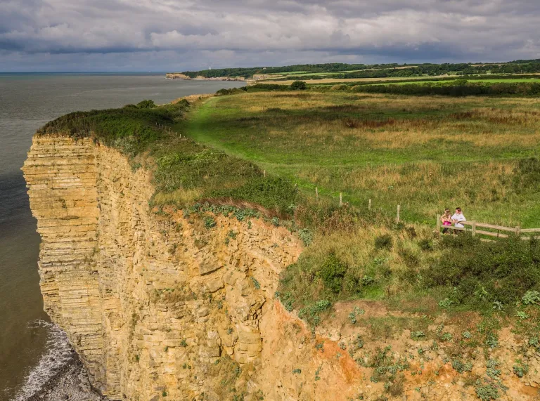 A view from above showing the cliffs and sea.
