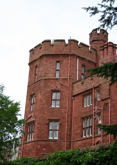 exterior of red brick castle.