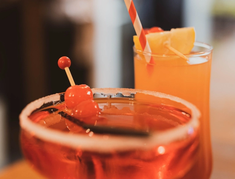 Two cocktails in glasses.