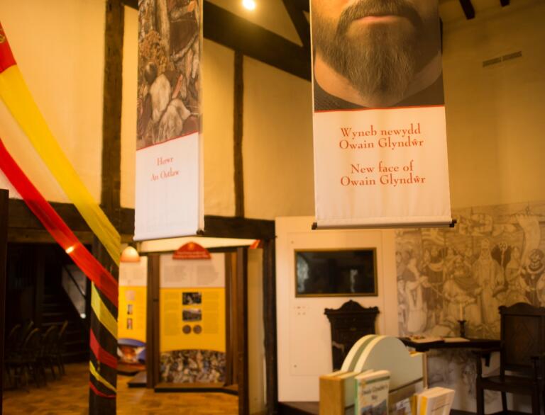 interior of Owain Glyndŵr Centre, with hanging banners.