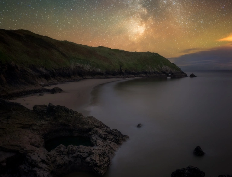 Milky Way above sea cove.