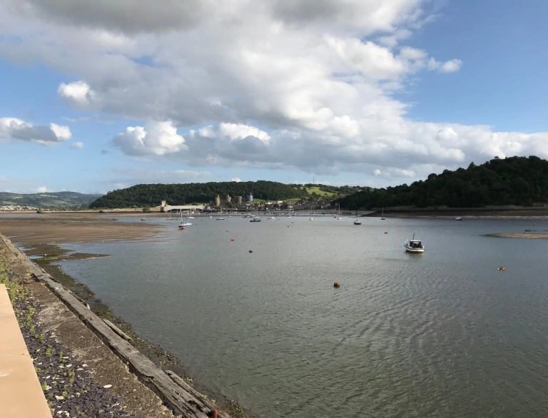 sea and castle view in distance.