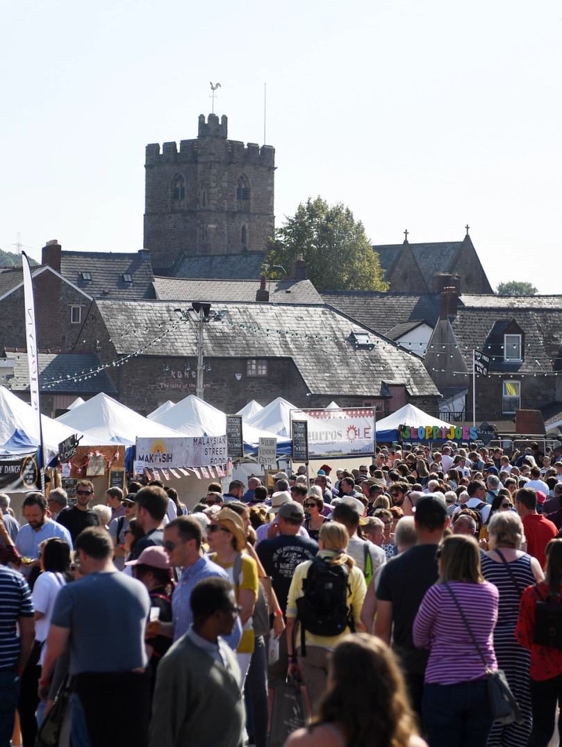 crowd at a busy outdoor food festival.