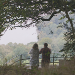 View of Nina and Joe Howden at The Eagle’s Nest, a viewpoint in the Wye Valley.