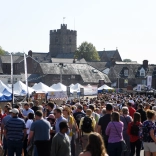 crowd at a busy outdoor food festival.
