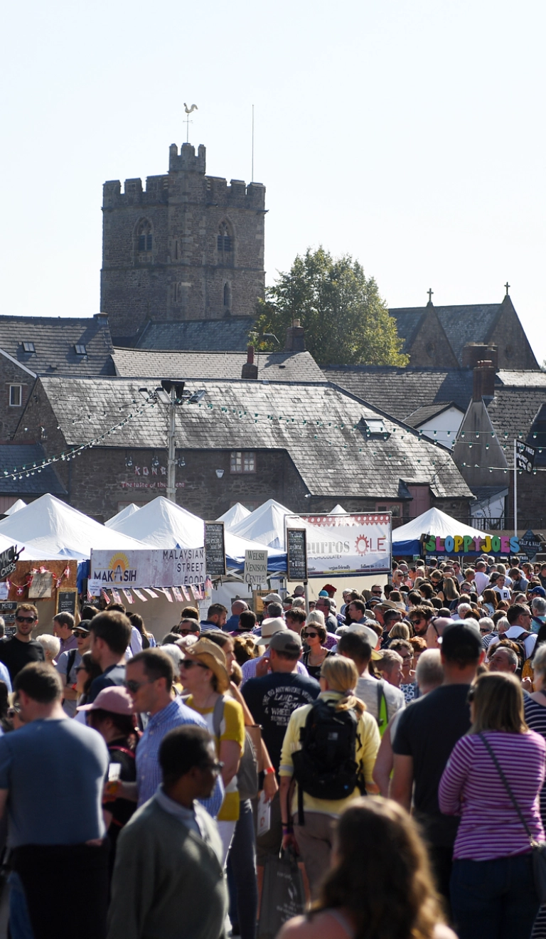 crowd at a busy outdoor food festival.